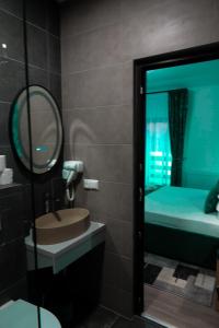 a bathroom with a sink and a mirror and a bed at Dey Villa, Valea Avrigului, Transilvania in Avrig +23 photos