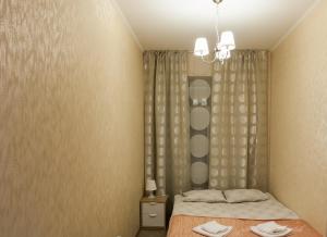 Кровать или кровати в номере NEVSKY 95 City Room