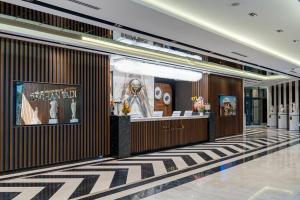 a lobby of a building with a museum at Batıhan Beach Resort & Spa in Kuşadası +146 photos