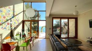 a living room with a couch and a table at Vila Nadja SEAFRONT in Bar