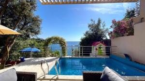 a swimming pool with a view of the ocean at Vila Nadja SEAFRONT in Bar