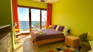 a bedroom with a bed and a large window at Vila Nadja SEAFRONT in Bar +60 photos
