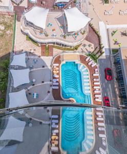 an overhead view of a swimming pool at a resort at White Tower Mamaia Beach 602 in Mamaia