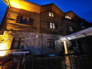 a building with a stone wall with lights on it at HEVAS Suite in Ayder Yaylasi