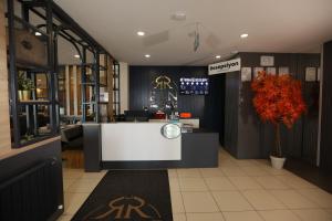 a store lobby with a white counter in the middle at Ren Business Hotel in Gerede