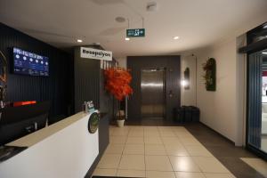 a lobby of a hospital with a hallway with a door at Ren Business Hotel in Gerede