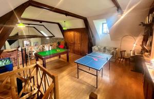 an overhead view of a living room with a ping pong table at Soulages in Najac