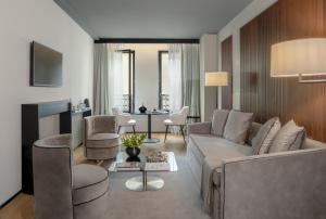 a living room with a couch and a table at Speronari Suites in Milan