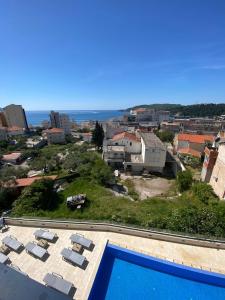 a view from the roof of a house with a swimming pool at Elia in Bečići