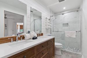 a bathroom with a large sink and a shower at Harbour Oaks, Unit 413 in Saint Simons Island +18 photos