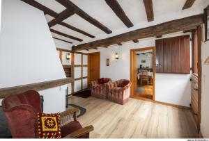 a living room with two chairs and a table at BeiArnold in Schleiden +11 photos