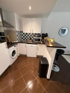 a small kitchen with a counter and a sink at Paula suite avec terrasse-Croisette, Plage Festival Palais in Cannes