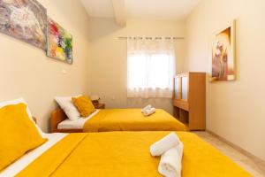 a bedroom with two beds and a window at Villa Zubčić in Zadar
