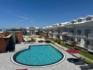 an image of a swimming pool on a apartment complex at Defne Beach Makri in Fethiye