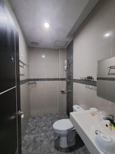 a bathroom with a toilet and a sink at Sleek Modern Studio in Rawai, Phuket in Ban Saiyuan (1) +19 photos