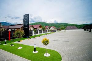 a large parking lot with trees in the middle at Leo Resort and Spa in Petrova