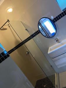a mirror hanging from the ceiling of a bathroom at Nvivi boutique hotel in Polokwane +10 photos