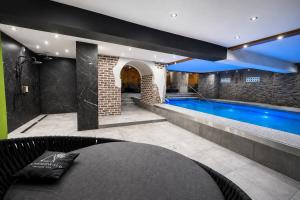 a swimming pool in the middle of a house at Familotel Der Böhmerwald in Eschlkam