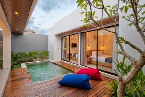 a pool in the backyard of a house at Tapan Harmony Villa Ubud in Ubud