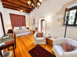 a large living room with a bed and a couch at Venetian Palace Chania - Adults Only in Chania +68 photos