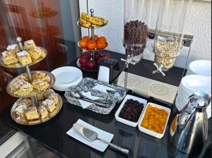 a table topped with lots of different types of food at Palisander z widokiem na morze in Trzęsacz +66 photos