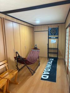 a room with a hammock and a sign that says relax at Garden-View ゆふ in Yufu