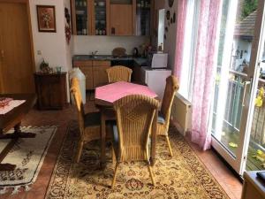 a kitchen with a table and chairs and a kitchen with a window at Apartment in Lennestadt for 2 Person in Lennestadt