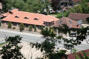 an overhead view of a large house with red roofs at Motel Restoran DURMITOR in Nikoljac