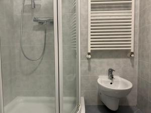 a bathroom with a shower and a toilet and a sink at Apartma Eva in Portorož +16 photos
