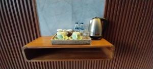 a tray of drinks and a coffee maker on a table at Umayuri Inn in Ubud +42 photos