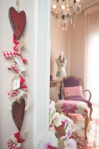 a mirror in a room with hearts on the wall at Apartment Corinth in Korinthos