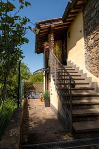 a stairway leading to a house with a door at Golden House in Bracciano