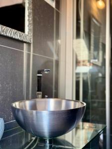 a bowl sink on a glass counter in a bathroom at Mala Porta in Trogir +23 photos