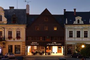 a group of buildings on a city street at U Černého medvěda in Jablonné nad Orlicí