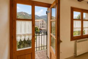a door leading to a balcony with a view at Winahost Espunyola Berga in L'Espunyola