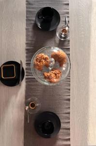 a table with a glass plate with food on it at fairytale home - panorama in Agropoli