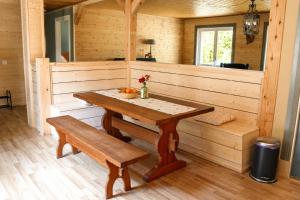 a wooden sauna with a wooden table and a bench at Lysviks guesthouse inclusief extra service in Lysvik
