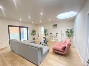 a living room with a couch and two chairs at 12-Guest Apartment on the Main Square in Antwerp +67 photos