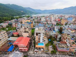 an aerial view of a city with a river at Hotel Sampada Boutique in Pokhara