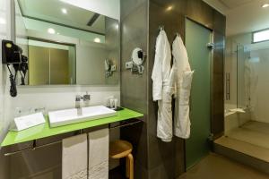 a bathroom with a sink and a shower at La Finca Resort in Algorfa