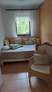 a large bed in a room with a window at Ferienhaus Triebesgrund in Zeulenroda