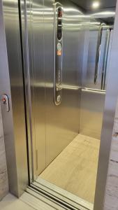 a metal elevator with a door in a room at Appartamenti Ariston - Centro Giulianova in Giulianova