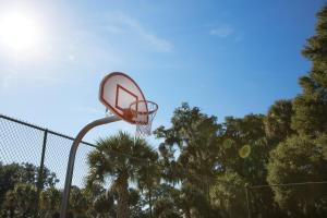 a basketball hoop on a fence at Ocean Ridge Resort 4BR Apartment in Edisto Island +41 photos