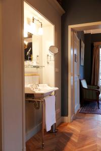 a bathroom with a sink and a mirror at Logement Swaenenvecht in Utrecht +96 photos