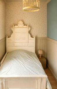 a bedroom with a bed with a white bed frame at Lysviks guesthouse inclusief extra service in Lysvik