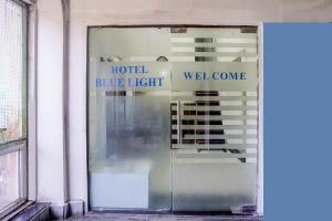a glass door to a hotel blue light at FabHotel Blue Light in Mumbai