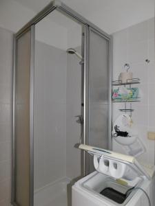 a bathroom with a sink and a washing machine at Luv in Althagen