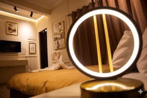a mirror on top of a bed in a room at Calmaa Kairo in Cairo