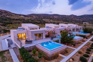 an aerial view of a house with a swimming pool at Aros Luxury Villas in Karpathos