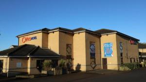 a building with a sign on the side of it at Coventry Hotel By Belvilla near City Centre in Coventry